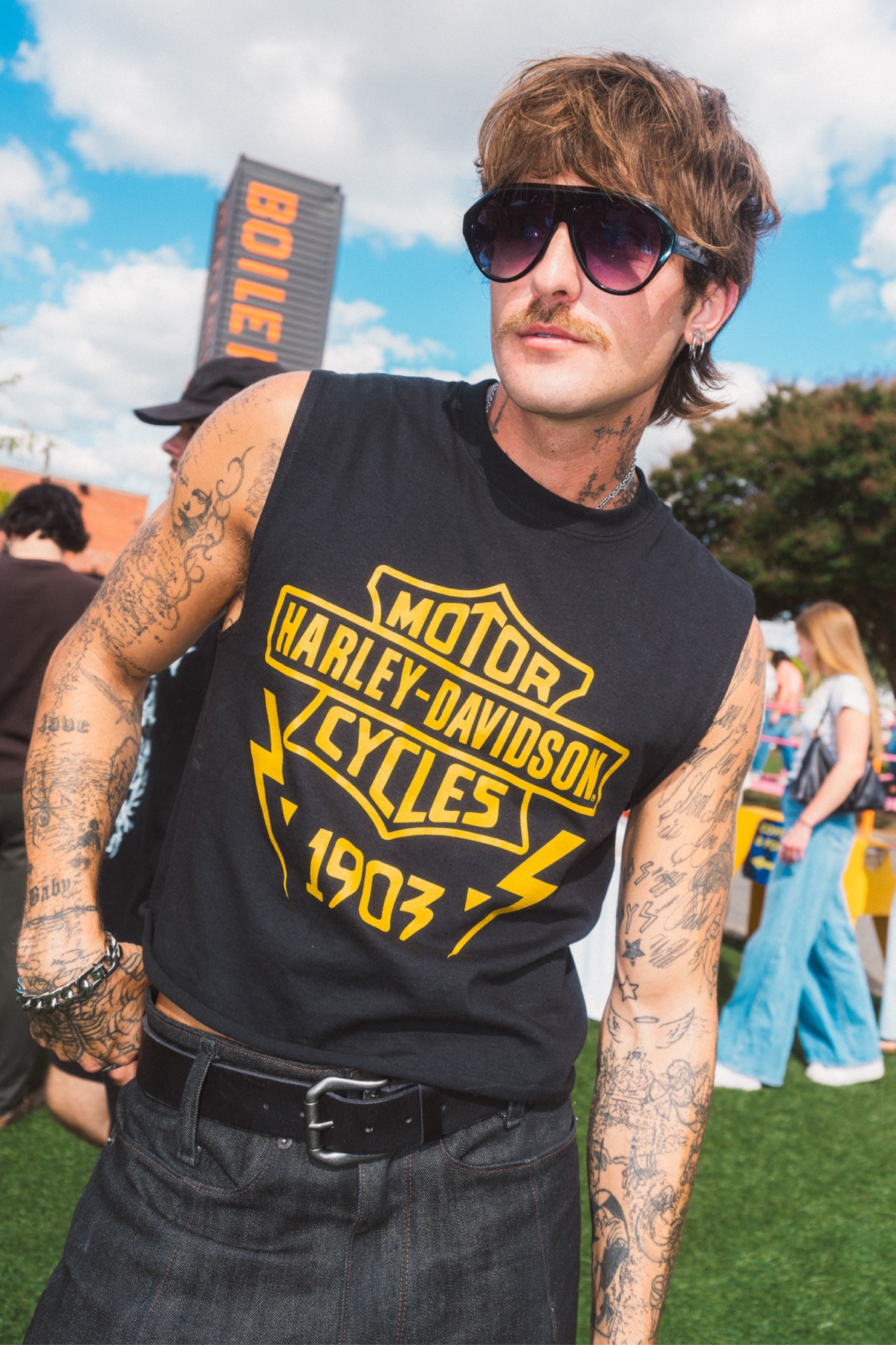 Street portrait, person in a Harley-Davidson tank top